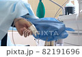 Close-up of a ventilator during an operation, FullHD shot. The movement is remembered by artificial lung ventilation, amid a ward with a patient and doctors. Pneumonia and tuberculosis, Covid 19 82191696
