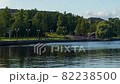 Time lapse view of city promenade where people walk in sunny day, tilting up 82238500