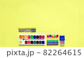video painting supplies on a colored background. Set of first grader on a yellow background. Office supplies in a layout on a yellow paper background. Flat layout. Stop motion 82264615