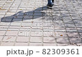 Shadow of a walking man 82309361