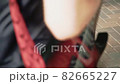 Hands of a man playing an electronic guitar 82665227