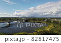The scenery of the swamp water surface where the blue sky is reflected and the bridge over it 82817475