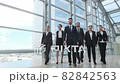 Business people team walking together 82842563
