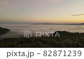 Aerial view of the city covered with a sea of clouds before sunrise 82871239