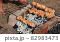 Man fries tradition kebabs shashlik on picnic. Close up. 82983473