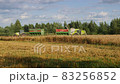 VELIKIE LUKI, PSKOV REGION, RUSSIA - August 08, 2021:Harvester machine working in wheat field 83256852