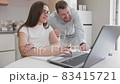Adult caucasian couple at home in smart working and remote work job activity sitting at the desk in 83415721