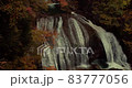 A big waterfall in the autumnal mountains 83777056