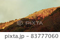 Autumn sky with light and autumnal mountains 83777060