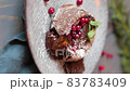dessert chocolate fondant on a wooden background with berry decoration. Dessert cut with a fork.vertical video 83783409