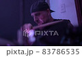 Emotional musician plays drum set with sticks on stage 83786535