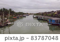 Hoi An river landscape city channel with moored boats 83787048