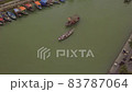 Hoi An river landscape motorboat and traditional vessel 83787064