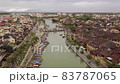 Hoi An river urban landscape channel with bridge and boats 83787065