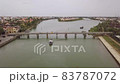 Hoi An river landscape transport bridge between city banks 83787072