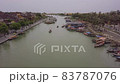 Hoi An river landscape people row boats along channel 83787076