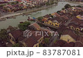 Hoi An city urban landscape old buildings on channel bank 83787081