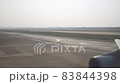 View from plane taxiing at an airport runway 83844398