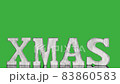Wooden christmas letters XMAS in vintage style rotate on green screen 83860583