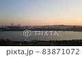 Seoul skyline at dusk looking across Han river from Haneul Park with plane flying in the sky 83871072