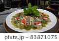 Thai style raw shrimp with spicy chili fish sauce on plate with dry ice smoke under the plate 83871075