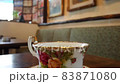 Hot coffee in beautiful flower cup in a coffee shop 83871080