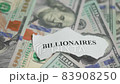 Billionaires income tax. Pile of us dollar banknotes and pieces of paper with Billionaires text. Billionaires income tax proposed in US Senat 83908250