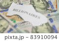 Billionaires income tax. Pile of us dollar banknotes and pieces of paper with Billionaires text. Billionaires income tax proposed in US Senat 83910094