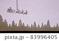 Puppet Shadow Theatre. Santa Claus on a sleigh with reindeer flies over the forest. Stick on top 83996405