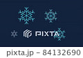 White and blue snowflakes appear in a dark blue sky 84132690