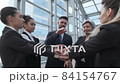 Business people stacking hands  84154767