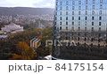 Glass building and autumn colors in the evening city 84175154