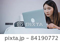 Asian woman sitting on the bed using laptop work remote working in hotel room 84190772