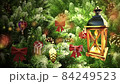 video postcard congratulations with santa claus, lantern with a candle, trees and Christmas decorations  84249523