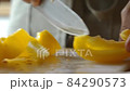 Man cooking fresh food at home. Closeup chef hands slicing pepper in slow motion. Male professional preparing vegetables with knife at home kitchen 84290573