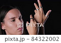 Elegant Woman Modeling Metal Rings 84322002