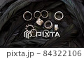 Beautiful Rings Lying on Black Feathers 84322106