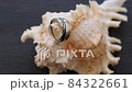 Metal Rings on Seashell 84322661