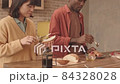 Happy Couple Making Breakfast Together 84328028