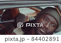 Pensive African American Man Sitting in Car 84402891