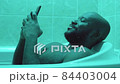 African American Man Using Phone while Taking Bath 84403004