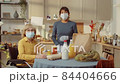 Volunteer And Senior Woman In Kitchen 84404666
