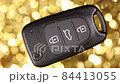 car key on a golden background. Close up. 84413055