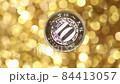 A coin in yuan on a gold background. close up 84413057