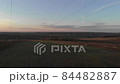 Aerial drone filming under electric poles at sunset 84482887