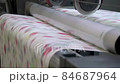 Industrial printer making new wallpaper sample. Modern wallpaper factory. Wallpaper production. One of step creation new wallpaper. Closeup 84687964