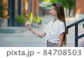 Cute girl gets her face refreshed in hot day 84708503