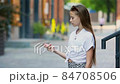 Cute girl gets her face refreshed in hot day 84708506