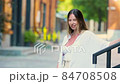 Young beautiful woman gets her face refreshed in hot day 84708508