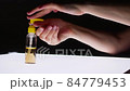 Female hands applying antibacterial liquid soap close up 84779453